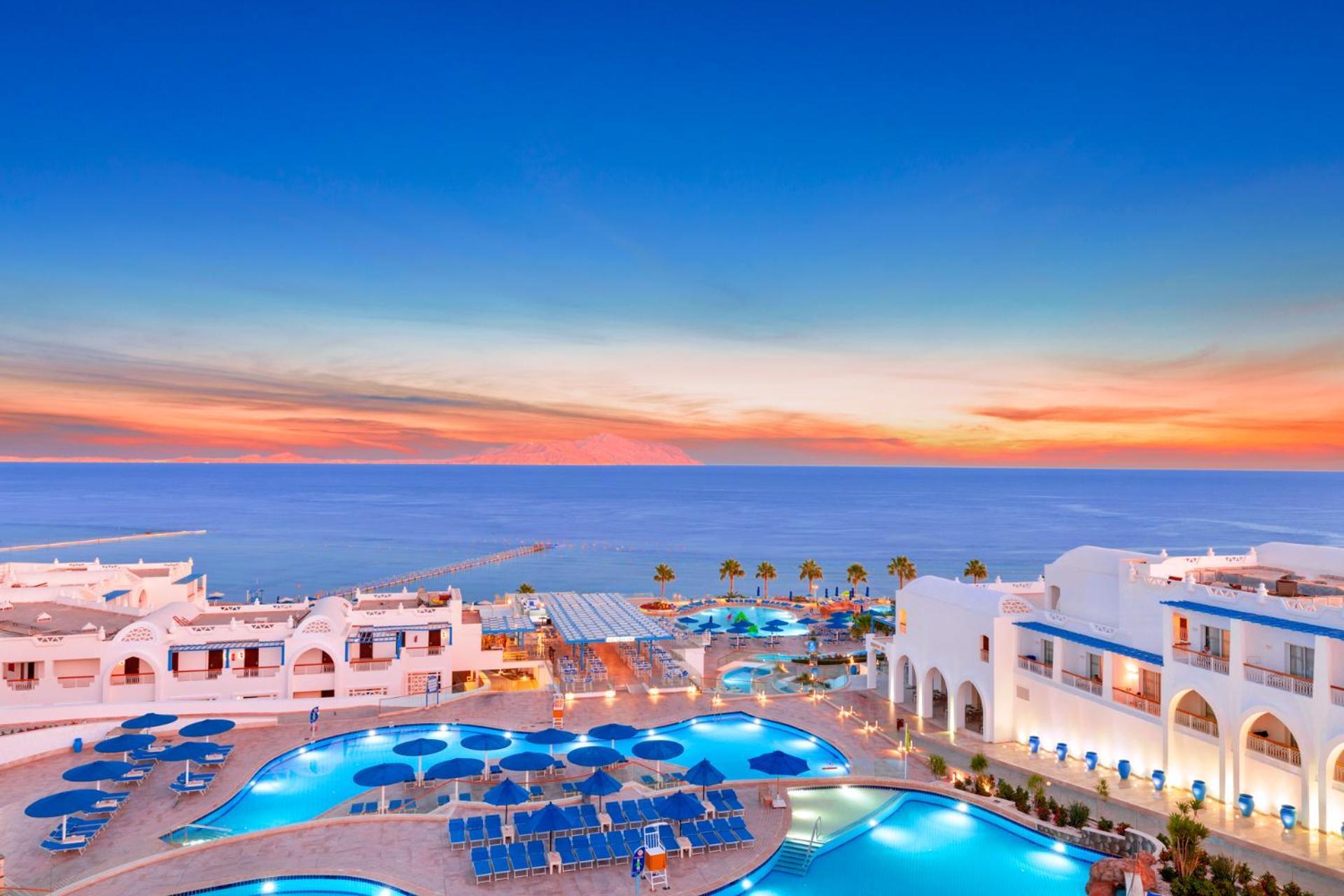 Pickalbatros Palace Sharm - "Aqua Park" Exterior photo Sunset at the Iberostar Grand Hotel Melia, in Benalmadena, Málaga, Spain.